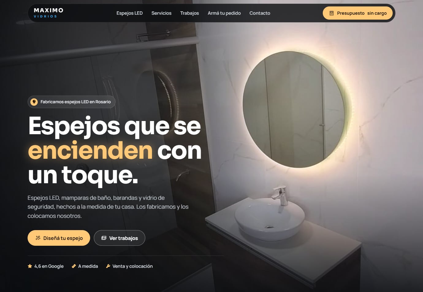 Captura de la muestra de Maximo Vidrios: un baño con un espejo redondo iluminado y el título «Espejos que se encienden con un toque».